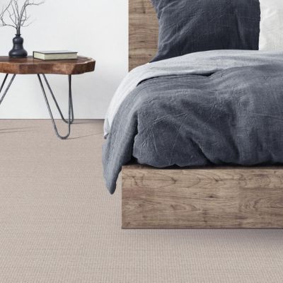 textured beige carpets in a calming rustic bedroom